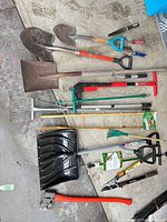 All fifteen tools laid out on concrete floor for overview
