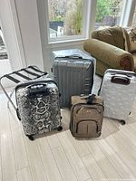 Group shot of all five luggage items and rack