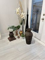 All nine decorative vases and accents near doorway