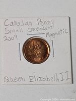Front of holder showing coin reverse maple leaves design