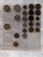 Front view of first plastic page with mixed coins