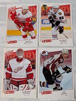 Front view of four Upper Deck Victory oversize hockey cards