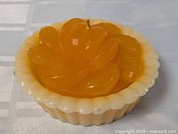 Top view of tangerine pie candle showing overall design and fluted base