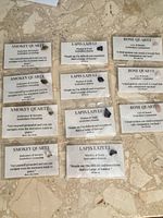 All eleven packaged gemstone cards on tabletop