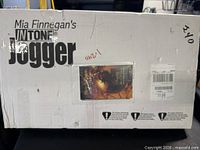 Factory box showing Mia Finnegan’s InTone Jogger branding and shipping label