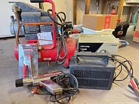 Group shot: Craftsman compressor, Sears charger with box, Penske timing light, connector tool
