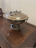 Hot pot assembled showing bowl, lid and base