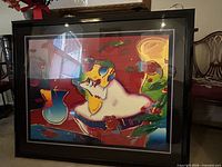 Front view of framed Peter Max print showing artwork, frame and glazing reflections