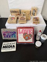 Group shot of all stamps, ink pads, embossing supplies
