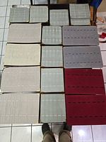 Grid view of all 16 ring display trays in four colours