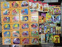 Group shot of all books laid out showing Little Mermaid series on left and assorted titles on right
