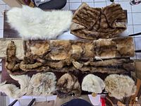 table view of eight assorted fur pelts and pieces