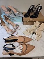 Overview of the five pairs of women’s heels on tabletop
