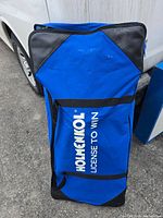 Full view of blue Holmenkol carry bag standing upright