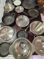 All cookware items laid out on table overview
