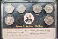 Front of sealed display showing six labeled coins