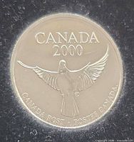 Obverse of Millennium medallion showing dove and legends