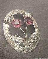 Front view showing double thistle design and gemstones