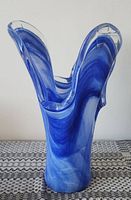 Front view of blue swirl art glass vase