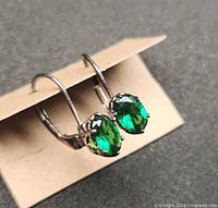 Front view of both earrings showing gemstones and settings