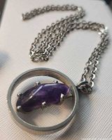 Front view of pewter pendant with amethyst on chain