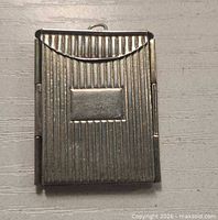 Front view showing ribbed design and cartouche