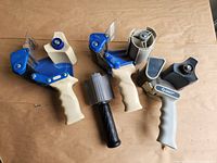 Four tape dispensers laid out showing overall condition and variety