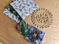 Group shot of all items: pot holders, dishcloths, trivet, cookie cutters