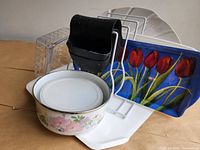 Overall lot showing tray stand, trays, utensil holder, enamelware pot, plastic container