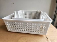 Perforated basket with nested tray and slotted baskets