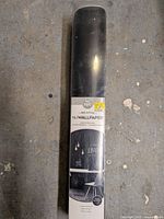 Front view of sealed chalkboard wallpaper roll showing brand and product line