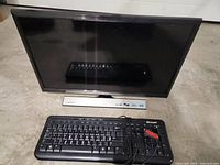 Front view of Samsung TV and Microsoft keyboard