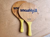 Two wood Smashball paddles front view