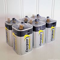 Six Energizer EN529 6-volt batteries standing upright showing branding and terminals