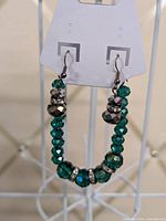 Full view of bracelet and earrings on display card