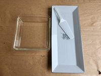 Square Pyrex dish beside porcelain platter and lifter