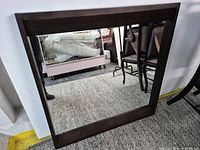 Full view of rectangular Shermag mirror showing dark wood frame and glass
