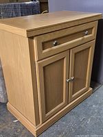 Front and side view of birch sideboard showing overall form and finish
