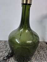 Front view of olive green recycled glass table lamp showing full height and hardware