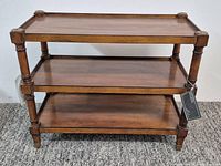 full front view showing three tiers and overall form