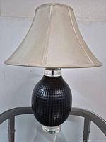 Full view of table lamp with shade