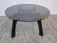 Full view of Natuzzi Italy round dark glass accent table