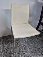 Full view of white leatherette chair front angle