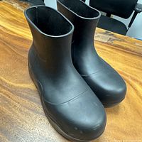 Front three-quarter view of both boots showing overall style and condition