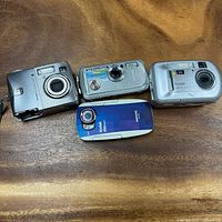 Front view four Kodak digital cameras
