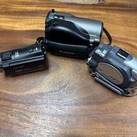 Three camcorders grouped on tabletop