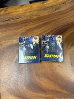 Front view of two sealed Batman Starter Deck boxes