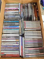 Top view of entire box showing rows of CD jewel cases