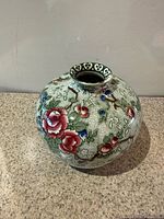 Overall view of spherical Chinese Rose vase