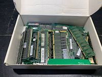 Box containing large quantity of mixed RAM sticks